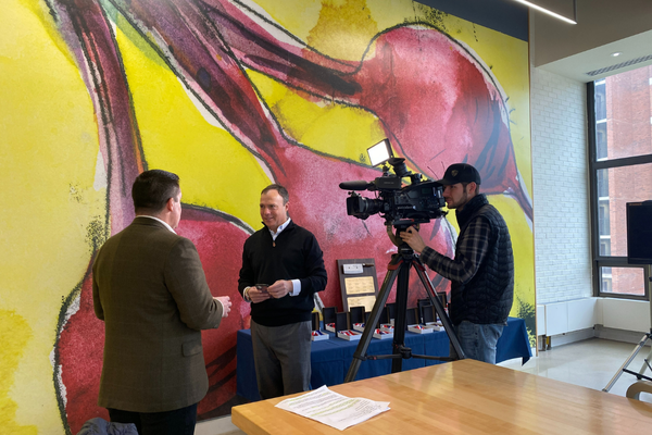 Dining staff being interviewed by reporter