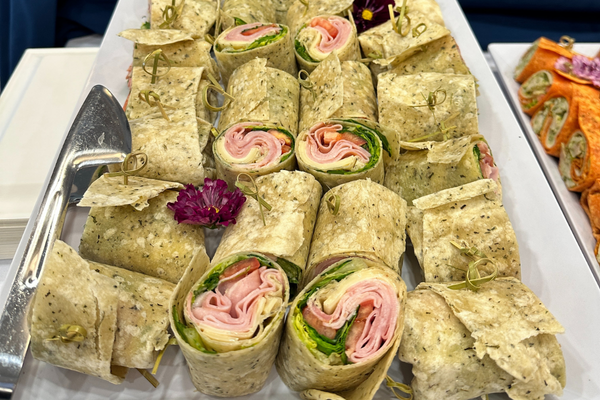 plate of cut ham wraps